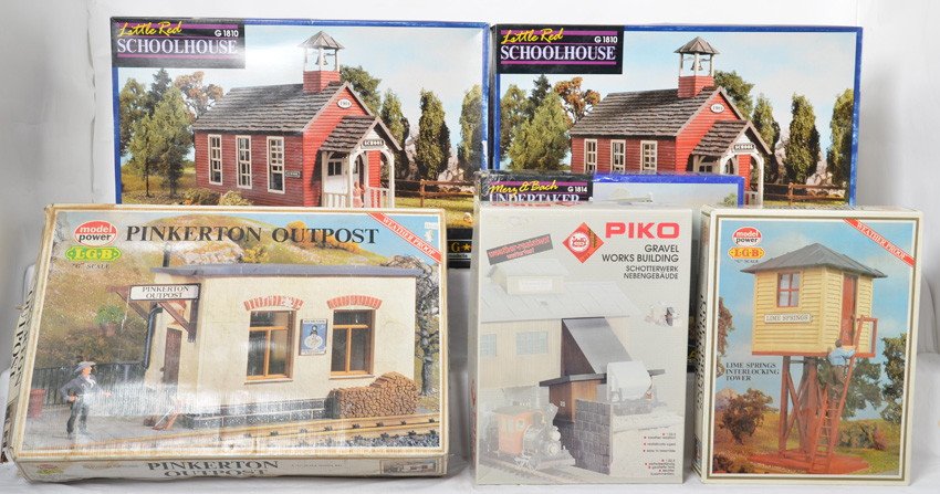 6 Pola kits 1814, 62010, 1623, etc: LGB / Pola modern G scale kits. Six kits include two 1810 school house kits marked as missing parts, 1623 Pinkerton outpost in water damaged OB, 1620 interlocking tower missing small parts, 1814 under