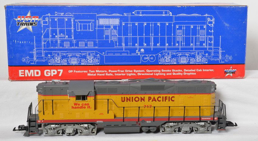 USA Trains Union Pacific GP-9 loco: USA Trains modern G scale Union Pacific 22106CL GP-9 loco in OB. Loco is C7-8 with run time, two small paint chips on roof, one missing cab window. OB has some corner and edge wear.