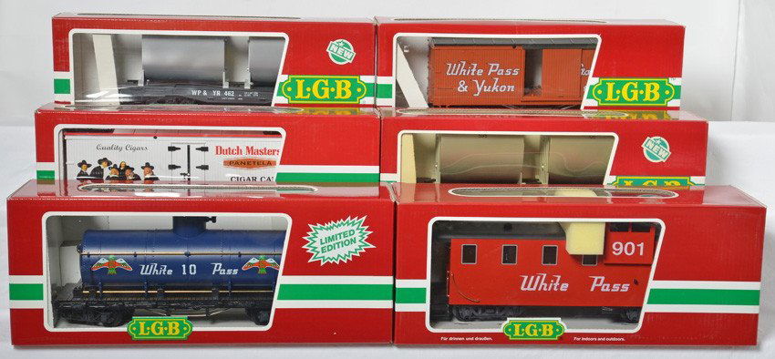 6 LGB freight cars 4080, 4086, 4167, etc: LGB modern G scale freight cars in OBs. Six cars include 46710 White Pass caboose, 4080 White Pass tank car, two 4086 White Pass ore cars, 43745 Dutch Masters boxcar, and 4167 White Pass boxcar. Cars
