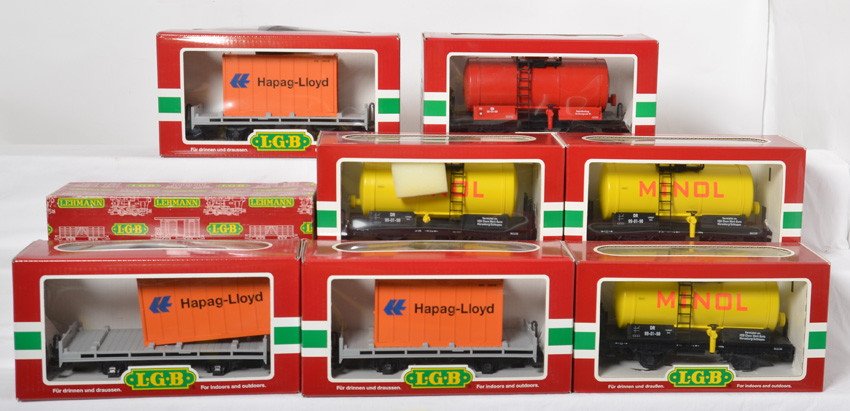 8 LGB freight cars 45400, 45403, etc: LGB modern G scale freight cars in OBs. Eight cars include three 42030 Hapag-Lloyd flats with containers, three 45400 Minol tank cars, 4024 gondola, and 45403 tank car. Cars are C7-8 with run time. OB