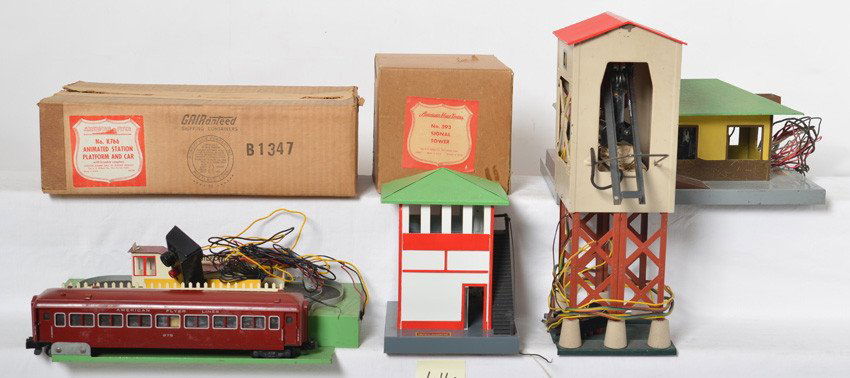 American Flyer accessories 785, 593, 597, K766: American Flyer postwar S gauge accessories. Includes 785 coal loader, 593 signal tower missing smoke stack and widows, some paint touchups and OB, 597 prewar talking station with mechanism, and K766 a