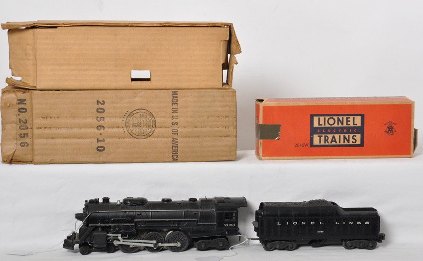 Lionel 2056 steam loco and 2046W whistle tender in OB: Postwar Lionel O gauge 2056 steam locomotive with 2046W whistle tender in original boxes, C6. Water scoop has melt mark and tender frame has some light surface rust. Loco box looks C7. Tender box has 