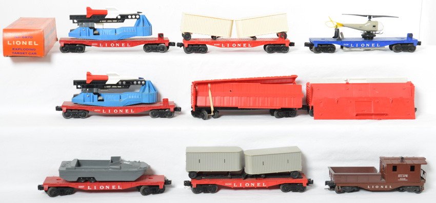 Lionel 6807, 6119, two 6650, 6430, 6440, 3419, more: Postwar Lionel O gauge 6807 flatcar w/amphibious military DUKW vehicle, 6119 Delaware, Lackawanna, and Western work caboose, two 6650 IBM missile launching cars, 6430 flatcar w/two trailer vans, 6440 