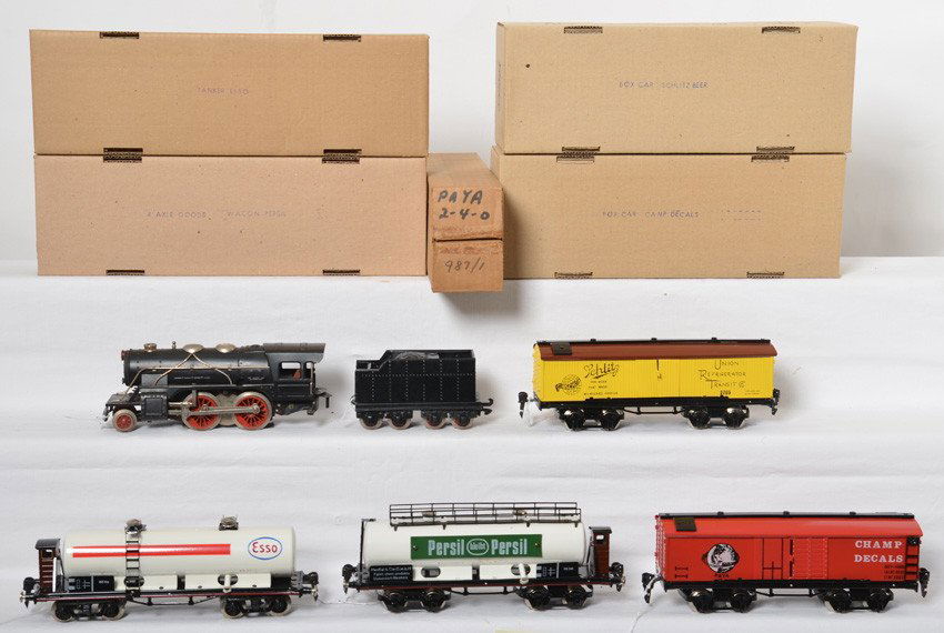 Paya 2-4-0 steam loco, two boxcars, two tank cars: Paya O gauge 3 rail 2-4-0 tinplate steam locomotive and tender with 1347 E Champ Decals boxcar, 1348E Schlitz Beer reefer, 1349 Persil 4 axle goods wagon, and 1356 A Esso tanker. Lcooc and tender look