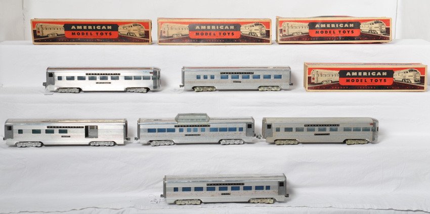 KMT Pennsylvania aluminum passenger cars w/OBs: Postwar KMT O gauge Pennsylvania aluminum passenger cars with four original boxes missing flaps. Diner, City of Chicago vista dome, 5260 baggage/combine, 3160 coach, City of Chicago observation w/ribb