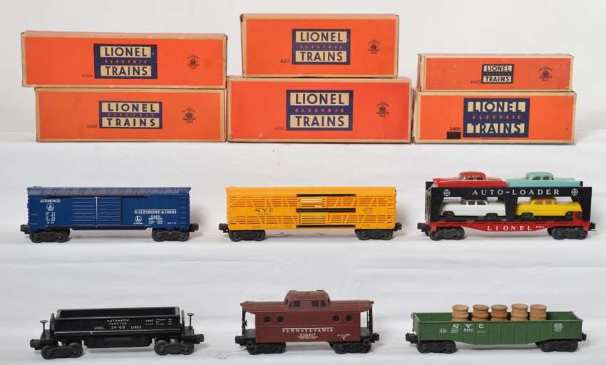 Lionel 6356, 6468, 3469, 6462, 6414, 6417 freight in OB: Postwar Lionel O gauge 6356 New York Central stock car, 6468 Baltimore and Ohio double door automobile boxcar, 3469 automatic dumping ore car, 6462 New York Central gondola with five wooden barrels, 6