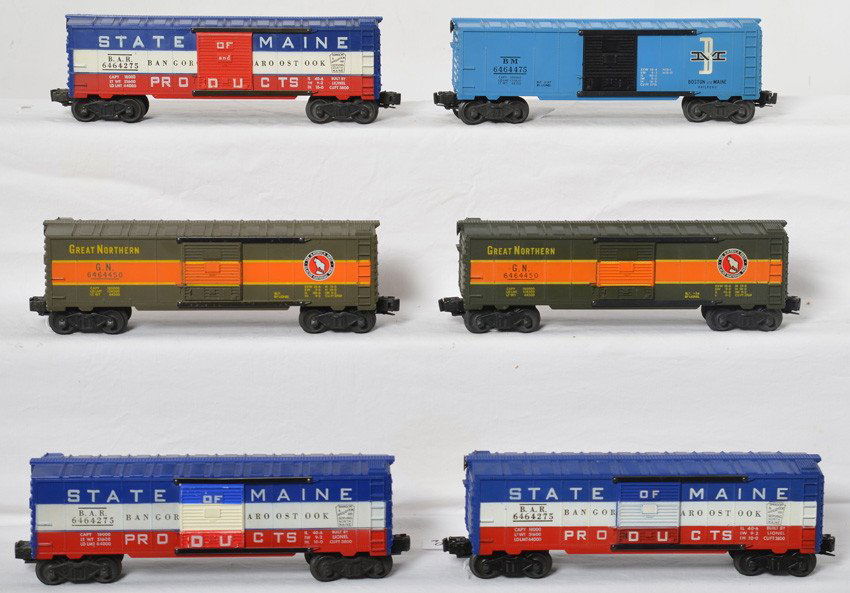 Lionel 6464-275 x3, 6464-450 x2, 6464-475: Postwar Lionel O gauge boxcars, three 6464-275 BAR State of Maine, two 646-450 Great Northern, and one 6464-475 Boston and Maine. Trains look C6-7. -275 have door variations, one has slightly askew he