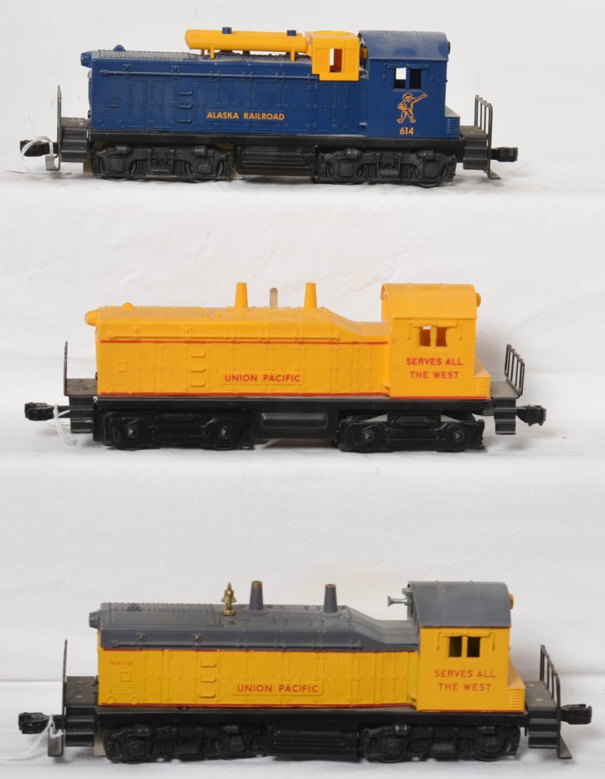 Lionel 613, 614, and 635 NW-2 diesel switchers: Postwar Lionel O gauge 613 Union Pacific, 614 Alaska Railroad, and 635 Union Pacific, NW-2 diesel switchers. 613 has typical crack at screw with touchups, 614 has super tight very hard to see hairline
