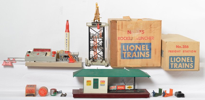 Lionel 75, 356, 394 operating accessories in OB: Postwar Lionel O gauge 75 rocket launcher, 356 freight station, and 394 rotating beacon, operating accessories with some components and some some inserts in original boxes. 75 has missing hand rail se