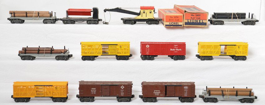 12 Lionel freight cars 2411, 6411, 34111, 6454, etc: Lionel Postwar O gauge freight cars. Includes 2411 flat, 6411 flat, 2411 flat, 3411 flat, X6454 New York Central boxcar, X6454 Erie boxcar, repainted 3559 dump car, 2560 crane, three 6656 stock cars,