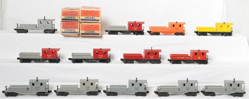 13 Lionel work cabooses 6130, 6419, 6119-25, etc: Lionel Postwar O gauge work cabooses. Thirteen cabooses include 6130 red Santa Fe, 6119-25 orange DL&W, 2419 DL&W, unmarked yellow body with black flat, three 6119 red cab, 6119 entirely red, and five