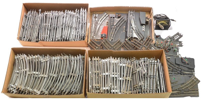 Marx Selection of Switches Crossovers Track: Marx selection of automatic and manual switches, 90-degree crossovers and a transformer. Also included is a large selection of O27 straight and curve track sections. Please view photo to verify select