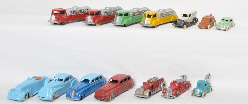 Tootsietoy trucks and cars, fourteen vehicles total: Tootsietoy diecast gasoline trucks, two and four door cars, Tootsietoy Dairy truck, fire trucks, tow truck, and more. Condition is excellent ranging C6 to C9-10. Gasoline trucks have Texaco, Shell, Si