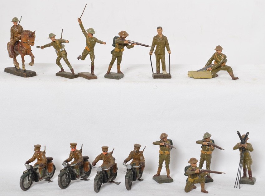 Fourteen Lineol WWI doughboy toy soldiers, motorcycles: Grouping of Lineol WWI doughboy style soldiers, four unmarked soldiers are on motorcycles (Indian/Harley style), one is mounted on horseback, one is pulling shells from case, one has long range field 