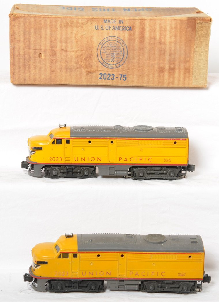 Lionel 2023 twin diesel Union Pacific Alco A units in: Postwar Lionel O gauge 2023 twin diesel Union Pacific Alco A units, powered unit has minor touchups around nose. Trains need white residue polished off shells. Trains should clean and polish to look C