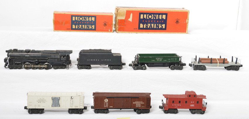 Lionel 2020, 6020W, 3459, 6411, 3462, 2458, 6357: Postwar Lionel O gauge 2020 steam locomotive, 6020W whistle tender, 3459 automatic dump car, 6411 lumber car, 3462 milk reefer, 2458 Pennsylvania double automobile boxcar, and 6357 SP caboose, trains