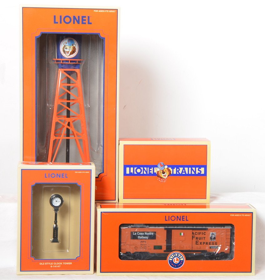 Small group of LCCA items in original boxes: Modern era Lionel O gauge 14154 #193 water tower, 26834 PFE ice car, 14147 old style clock tower, and Schylling railroad hand car, C9-10. Boxes show very little to no wear.