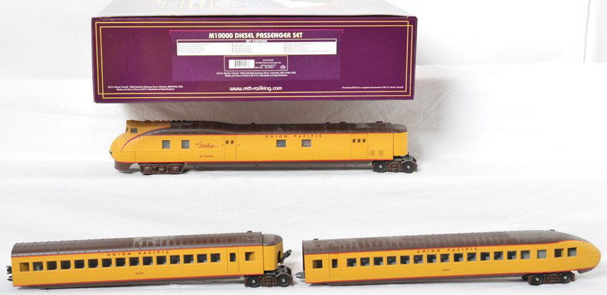 MTH Union Pacific M-10000 set with Proto 2: MTH modern O gauge Union Pacific M10000 set in OB. Catalog number is 20-2298-1. Loco features Protosound 2.0, DCS control, Protosmoke, and more. Set is C8+ with light run time and shelf dust.