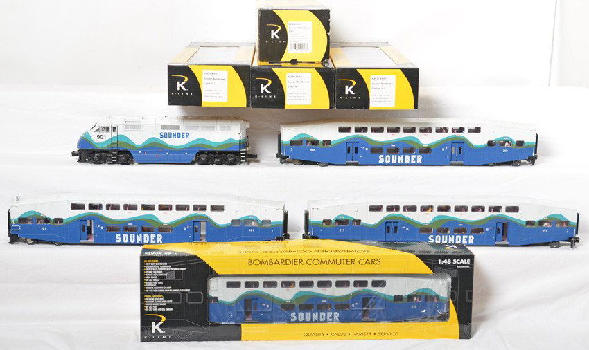 K Line Sounder F59PHi and cars with TMCC: K Line modern O gauge Sounder train set in OB. Includes K2436-3003 F59PHi loco with TMCC and Railsounds. Also included is K4636-F Bombardier four car set. Two broken ladders and some light spotting no