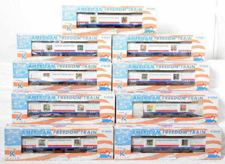 9 K Line American Freedom Train display cars: K Line modern O gauge American Freedom Train nine car passenger set in OBs. All cars have 4601 prefix. Cars include 30102 Exploration and Expansion display car, 30103 Growth of a Nation display car, 3
