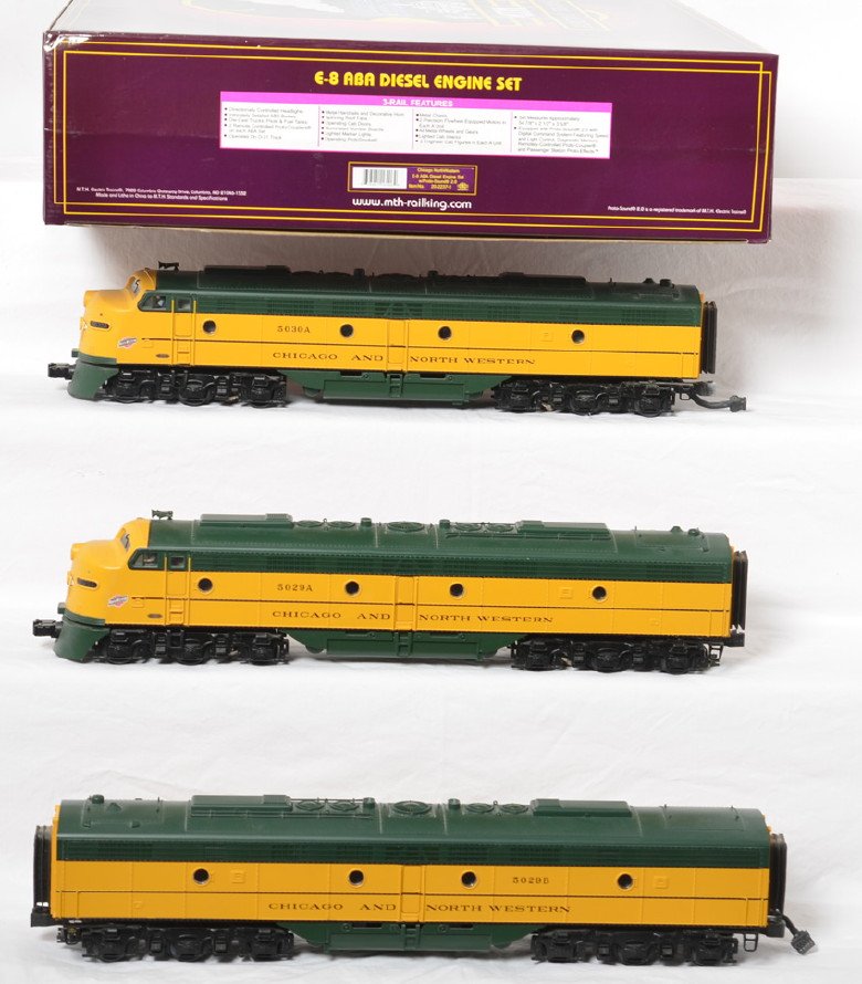 MTH C&NW E-8 A-B-A with Proto 2: MTH modern O gauge 20-2237-1 Chicago and Northwestern E-8 A-B-A set in OB. Powered loco features Protosound 2.0, DCS control, Protosmoke, Protocouplers, and more. Locos are C8 with light roller mark a