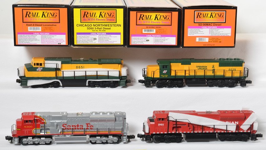 4 Railking diesel locos C&NW, ATSF, CP, with Locosound: MTH Railking modern O gauge diesel locomotives in OB. Four locos include 30-2155-0 Chicago and Northwestern Dash-8, 30-2121-0 Santa Fe SD-90, 30-2225-0 Canadian Pacific SD-90, and RK-2006 Chicago and 