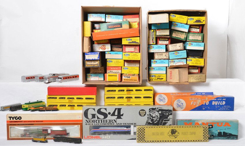 Large group of vintage HO cars and locos: HO trains. Some vintage stuff here including 53 cars from Athearn, Tyco, Hi- Ballers, etc. Six small boxes of parts, Manuta 4-4-0 loco, Sierra 4-6-0 steam locomotive, General style loco parts,Varney G