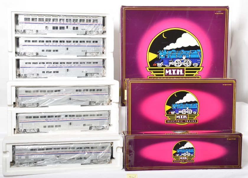 MTH Amtrak Superliner 4 car set and 3 add ons: MTH modern O gauge 20-6537 Amtrak Superliner 4 car passenger set in OB. This set is the five stripe version. Also includes 20-6541 diner and sleeper add on as well as 20-6542 transition sleepers. Both