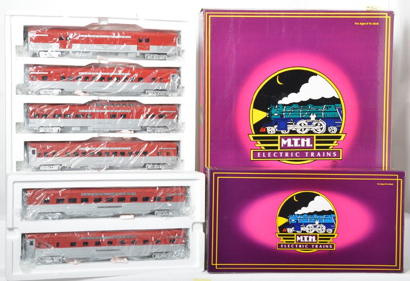 MTH Rock Island 7 car passenger set: MTH modern O gauge Rock Island Golden State seven car passenger set in OBs. Includes 20-6512 five car set and 20-6612 diner / sleeper add on. Cars are C8+ with light run time. OBs have some shelf wear