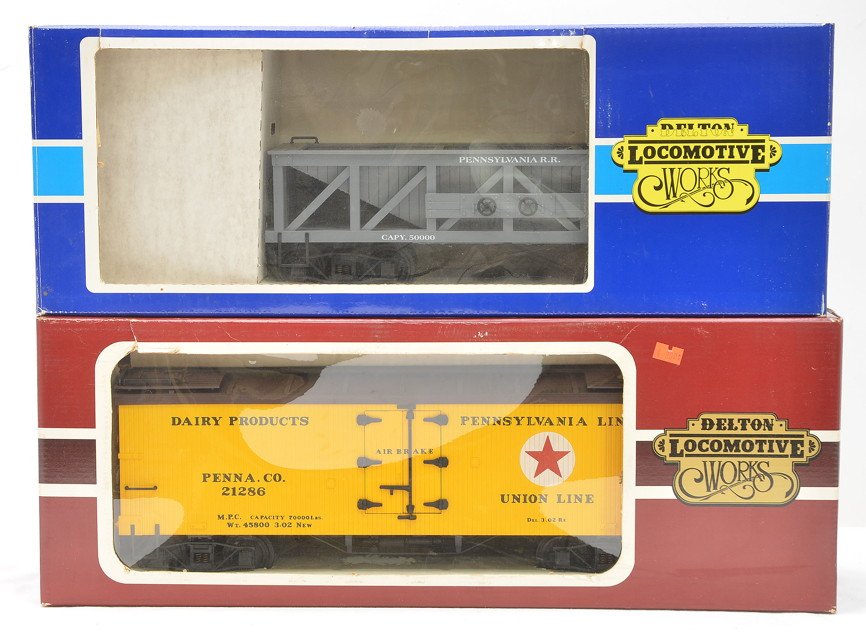 Delton Locomotive Works Freights 4253P 4258U: Delton Locomotive Works G scale freight cars 4253P Pennsylvania hopper and a 4258U Union Line Dairy Products reefer both in OBs. The cars are C8.