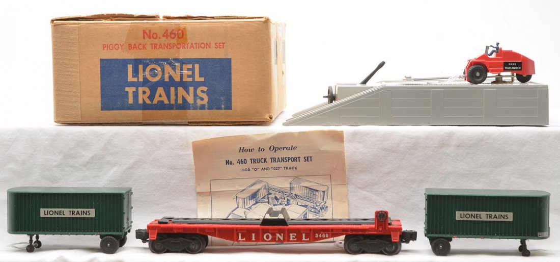 Lionel 460 Piggy Back Transportation Set OB: Lionel postwar 460 piggy back transportation set with flatcar, platform, two green Lionel Trains trailers, trailoader and instruction sheet in OB, C7. The OB is complete with all flaps.