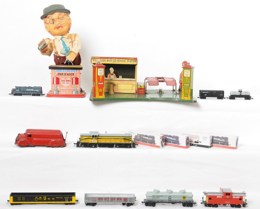 Nice lot of Vintage Toys and newer Trains: Nice grouping of vintage toys and newer small scale trains. Charley Weaver battery operated bartender toy C6-7. Marx lithographed pressed steel/tinplate Roadside Rest Service Station with an ALL METAL