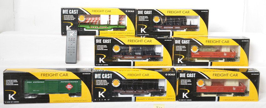 7 K Line and K Line by Lionel operating cars and remote: K Line and K Line by Lionel modern O gauge operating cars and remote control. Seven cars are in OBs and include two 21437 Southern log dump cars (one marked as fixed), 21251 REA boxcar, two 21353 Jers