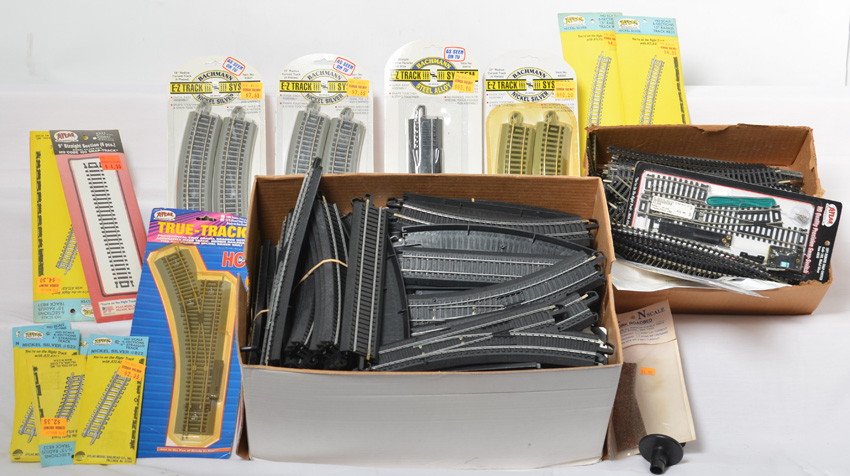 Two large boxes of HO Track, switches, Bachmann EZ: Two large boxed full of HO track from Bachmann and Atlas. A bulk of the group is Bachmann EZ track. Numerous switches, straights, curves and more. Some lightly used, a nice group of new switches. See 