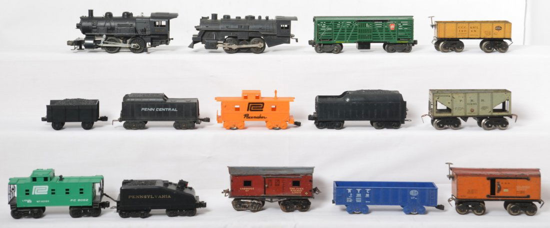 Mixed lot of Dorfan, Ives, Marx and Lionel trains: Mixed lot of O gauge trains. Includes Dorfan 14048 New York Central gondola, 11201 Pennsylvania hopper, and 517953 Pennsylvania boxcar. Ives includes a 67 caboose. Lionel items include 9062 Penn Centr