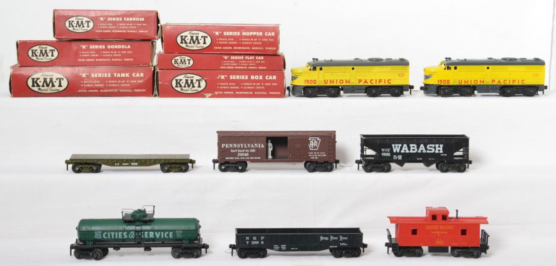 Kusan/KMT UP 1500 diesel Alcos w/six freight cars in OB: Postwar Kusan/KMT O gauge Union Pacific 1500 diesel Alco A units with no boxes, C6. K410C U.S. Army 42010 flatcar in OB, 29048 Pennsylvania boxcar in OB, 36180 Wabash hopper in K-202 Pennsylvania OB,