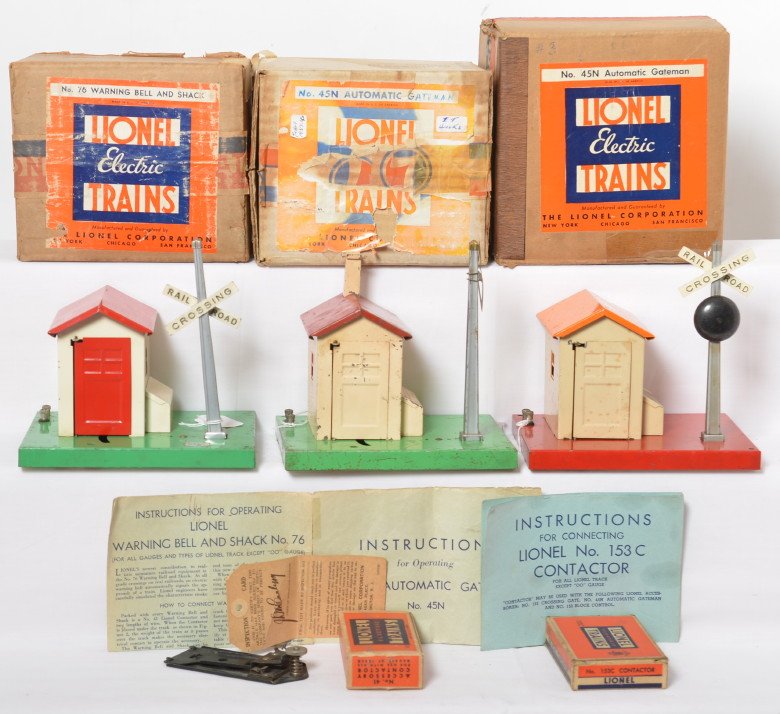Two Lionel 45N and one 76 in original boxes: Prewar Lionel O gauge No. 45N automatic gateman in original boxes with instructions sheets and other components, and 76 warning bell and shack, should clean C6 area. Boxes are square and solid with 76
