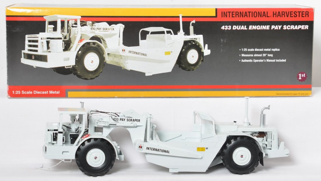 First Gear 79-0184 International Harvester 433 scraper: First Gear 79-0184 International Harvester 433 dual engine pay scraper, 1/25th scale in original box, C9-10. Box shows light wear. Not shown but included is the ownerÍs manual.