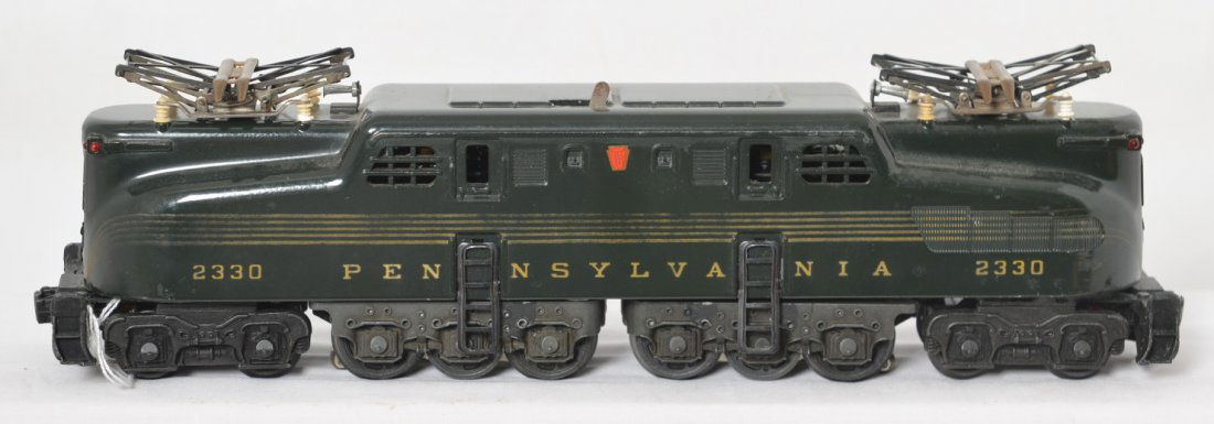 Lionel 2330 Pennsylvania GG-1 five-stripe electric: Postwar Lionel O gauge 2330 Pennsylvania GG-1 five stripe electric locomotive. Stripes are stronger on one side than other, paint is extremely solid and shiny with little loss, very clean C6+.