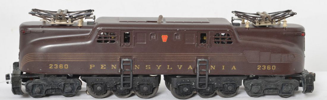 Lionel 2360 Pennsylvania Tuscan 5-stripe GG-1: Postwar Lionel O gauge 2360 Pennsylvania Tuscan 5-stripe GG-1 electric locomotive. Nice stripes that are very even from end to end, one very small touchup on each side, C6-7.
