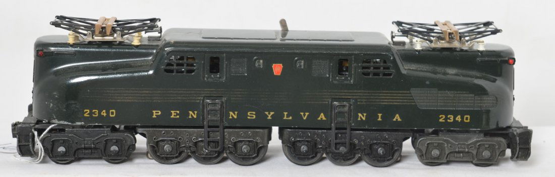 Lionel 2340 PRR 5-Stripe GG-1 electric locomotive: Postwar Lionel O gauge 2340 Pennsylvania 5-stripe GG-1 electric locomotive, small touchup/wear to a nose corner, otherwise nicer C6.