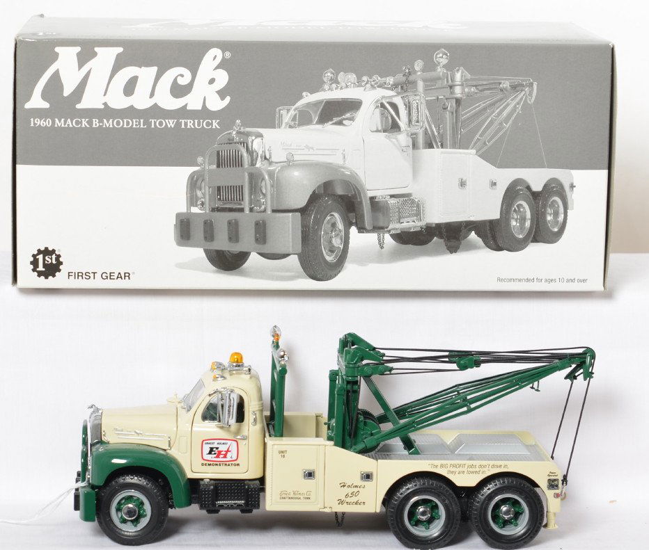 First Gear 48-0029 1960 Mack B-Model Tow Truck in OB: First Gear 1:25th scale diecast 48-0029 Ernest Holmes Demonstrator 1960 Mack B-Model Tow Truck toy in original box, missing a front turn signal trim piece and a little styrofoam on some wheels, otherw