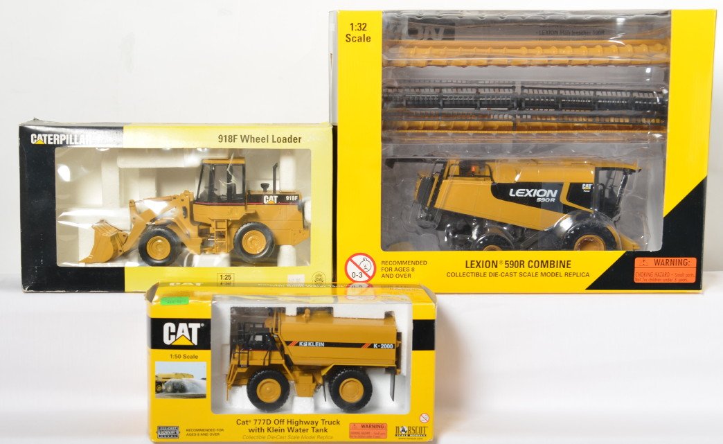 Norscot 56018, 55142, and 918F Wheel Loader in OB: Norscot diecast construction vehicle toys in original boxes. 56018 1:32nd scale Lexion 590R Combine. 55142 Cat 777D Off Highway Truck with Klein Water Tank. Unnumbered Caterpillar Cat 918F Wheel Loade