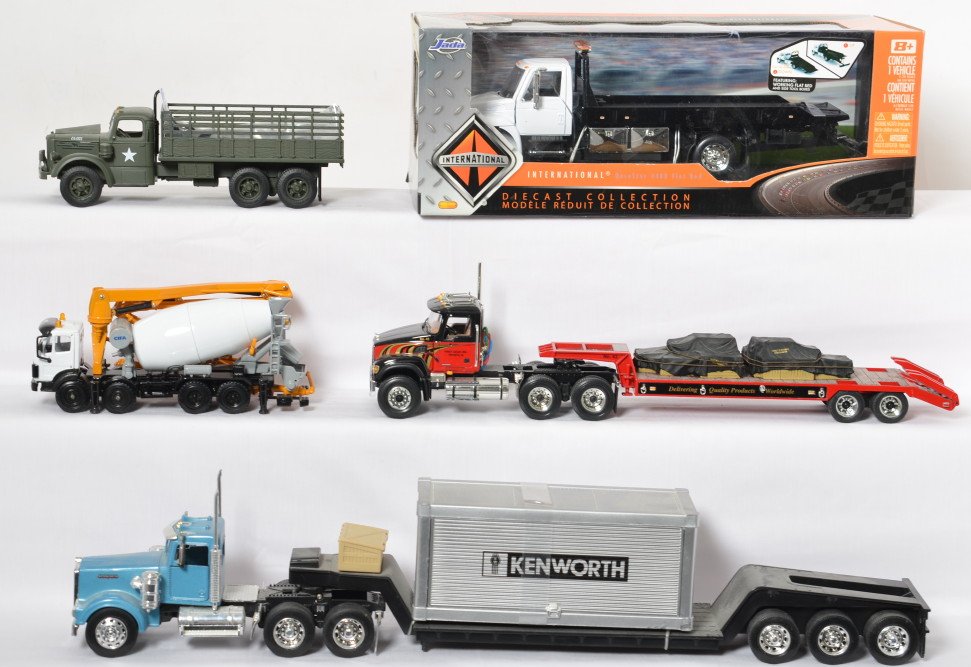 New Ray, First Gear, Jada, construction, military,: Various diecast toy trucks of different scales. New Ray semitractor with trailer, unmarked CIFA concrete truck, First Gear semitractor and trailer, First Gear military truck, and Jada 92351 Internatio