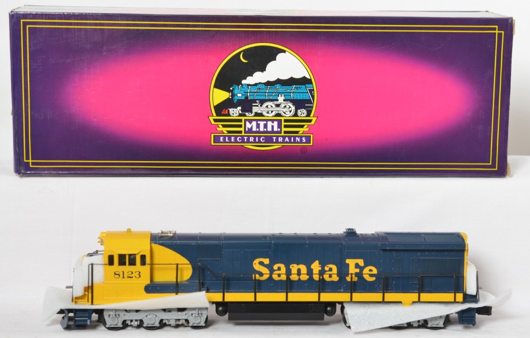MTH Santa Fe Alco C30-7 with Proto: MTH modern O gauge 8123 Santa Fe Alco C30-7 diesel locomotive in OB. Loco features Protosound, Protocouplers, and much more. Loco is C7-8 with moderate run time. OB has some light corner wear.