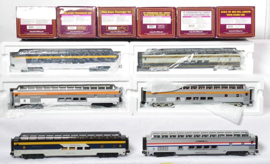 6 MTH vista domes C&O, B&O, Amtrak: MTH modern O gauge vista domes in OBs. Six cars total. Two Baltimore and Ohio include 6765 and 67132. Three Chesapeake and Ohio include 67017, 6749, and 67125. Also included is an Amtrak in the incorr