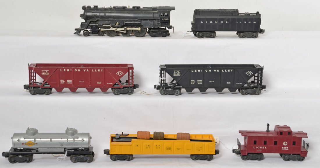 Lionel 2065, 6026W, 6436-25, 3562-50, etc: Lionel Postwar O gauge trains including 2065 steam locomotive, 6026W whistle Lionel Lines tender, 6436-25 Lehigh Valley hopper, 6436-1 Lehigh Valley hopper, 3562-50 Santa Fe operating barrel car missi