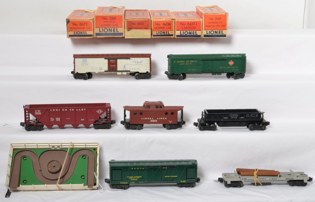 Lionel 3361, 6672, 6572, 3469, 6427, 6436-35, 3356: Lionel Postwar O gauge freight cars in OBs. Includes 3361 Lionel Lines log car with instruction sheet, 6672 Santa Fe reefer, 6572 REA reefer, 3469 operating dump car, 6427-1 Lionel Lines caboose, and 