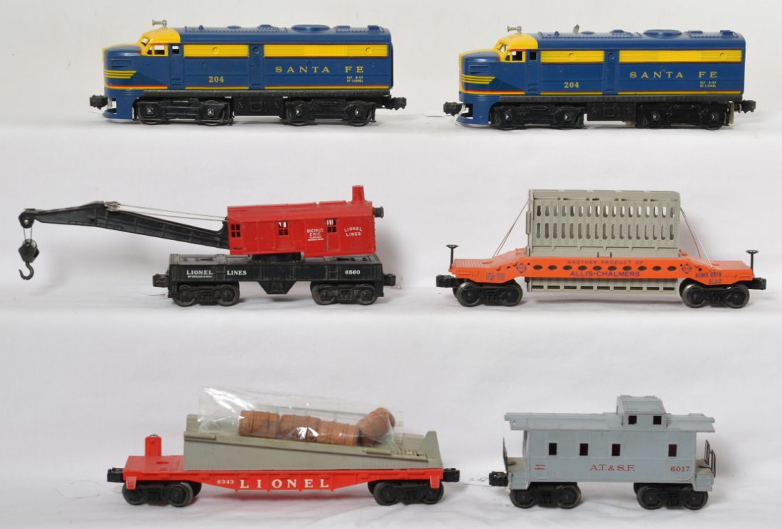 Lionel 204 S.F., 6519, 6343, 6560, 6017 diesel freight: Postwar Lionel O gauge 204 Santa Fe Alco diesel A unit, 6519 Allis Chalmers car (possible hairline at one brake wheel), 6343 barrel ramp car, 6560 operating crane, and 6017-185 A.T.&S.F. caboose. Trai