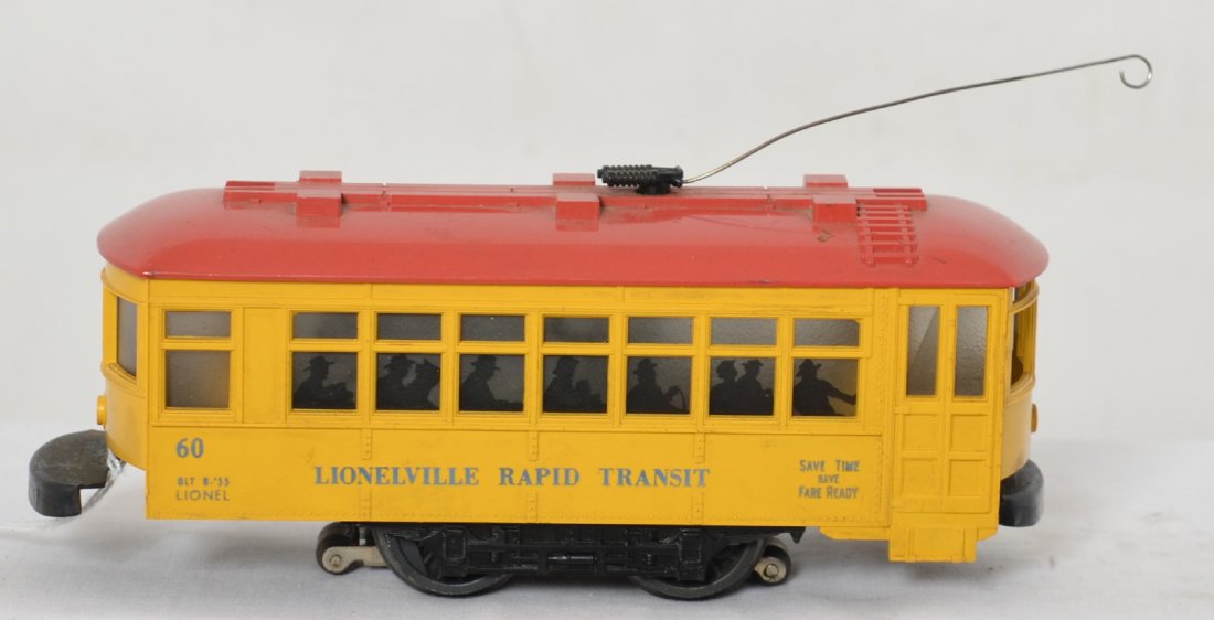 Lionel 60 trolley: Lionel Postwar O gauge number 60 trolley. Lower C7 condition with some light rust on the bumpers and some light wear to the roof and a bent trolley pole.